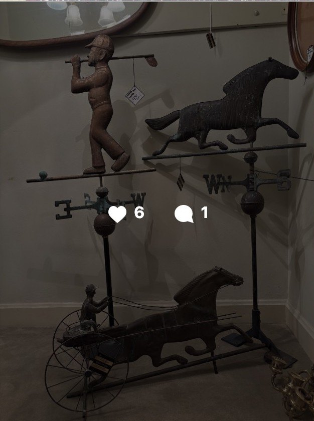 Folk-art weathervanes: a running horse with a figure and a horse-and-sulky, mounted on stands.